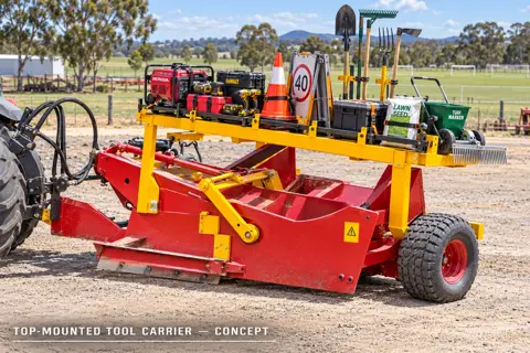 Top-mounted tool carrier grading scraper — application concept
